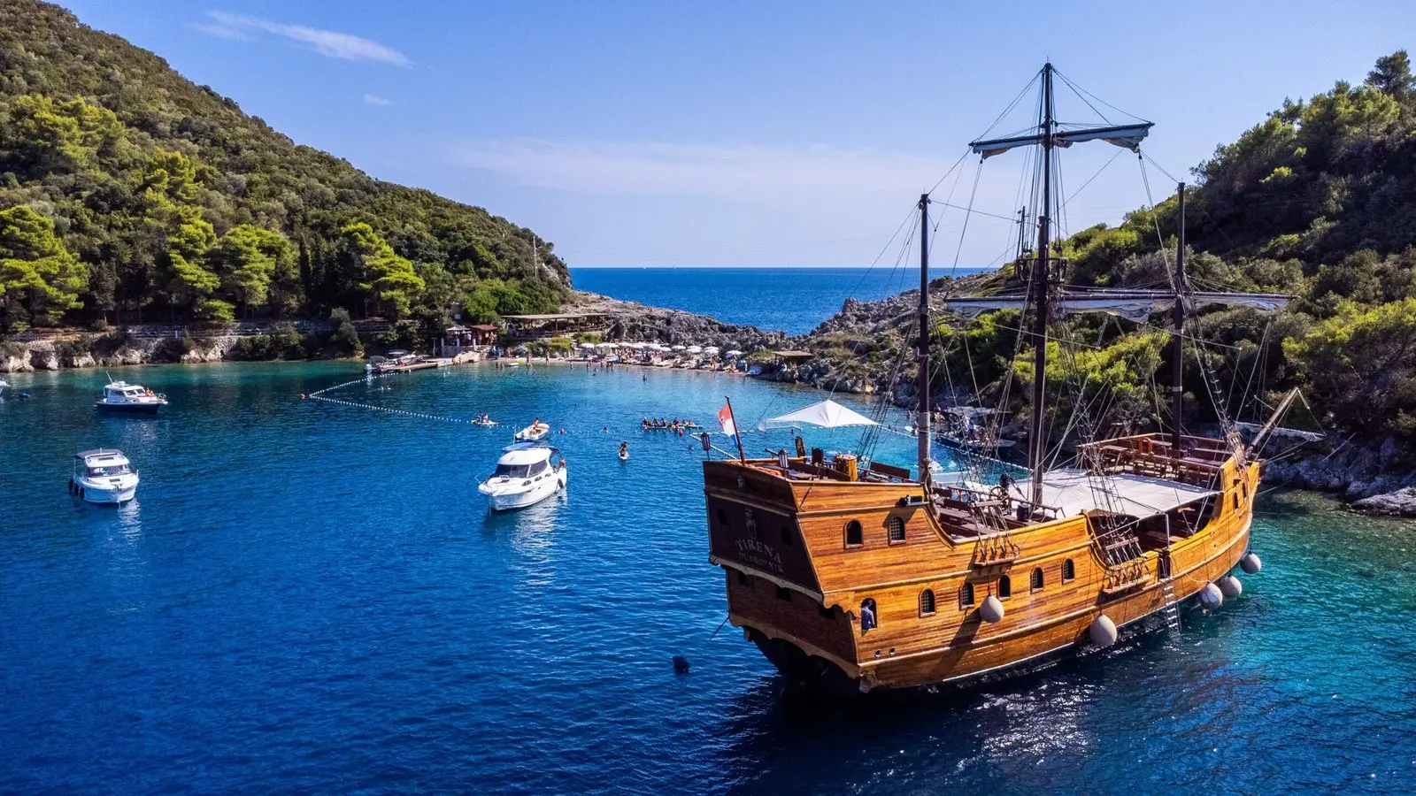 The pirate boat anchored in the bay beside the sea court